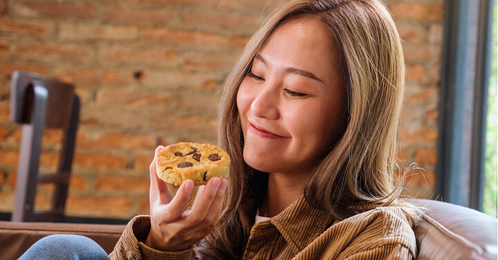 Serving up sweet nostalgia: why we crave the tastes of our childhood Woman eating a cookie