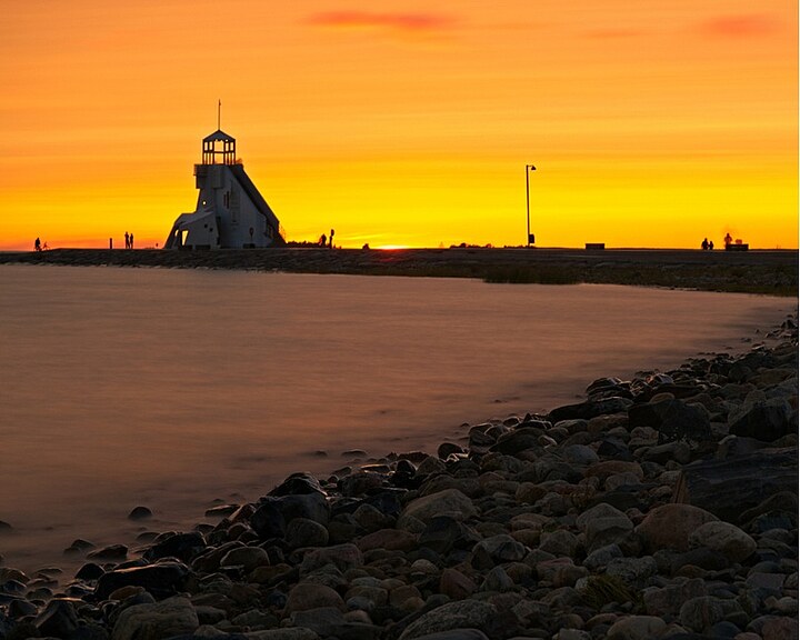 Beach view with lighthouse evening